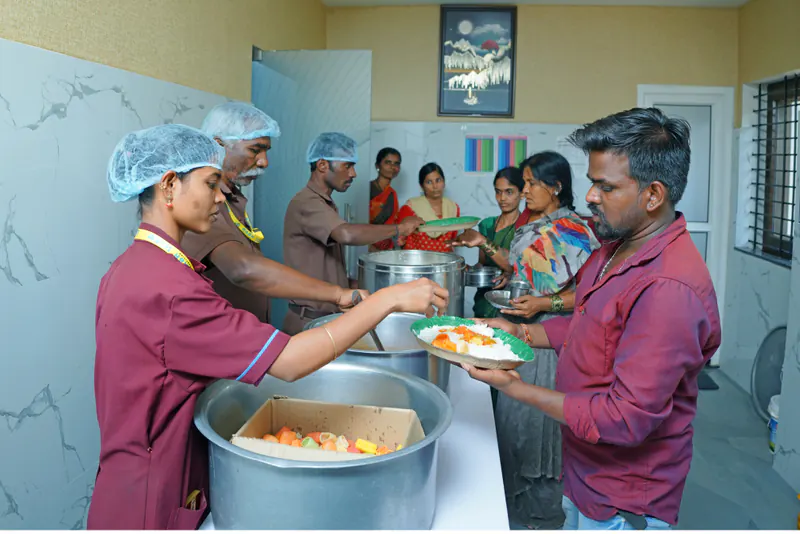 Hospital team serving nutritious warm meals and community care to patients' families